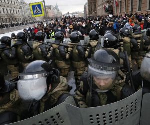 epaselect epa08977176 Russian police officers during an unauthorized protest in support of Russian opposition leader Alexei Navalny, in St. Petersburg, Russia, 31 January 2021. Navalny was detained after his arrival to Moscow from Germany, where he was recovering from a poisoning attack with a nerve agent, on 17 January 2021. A Moscow judge on 18 January ruled that he will remain in custody for 30 days following his airport arrest. Navalny urged Russians to take to the streets to protest. In many Russian cities mass events are prohibited due to an increase in COVID-19 cases.  EPA/ANATOLY MALTSEV