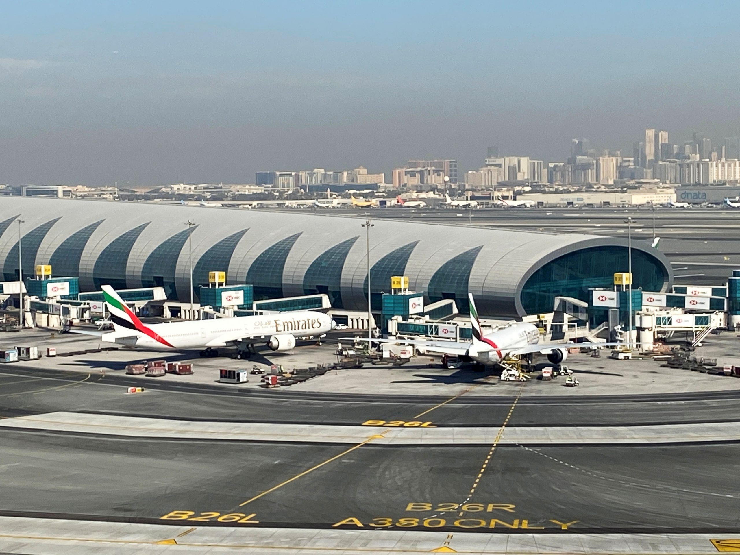 FILE PHOTO: Emirates planes are seen on the tarmac in a general view of Dubai International Airport in Dubai, United Arab Emirates FILE PHOTO: Emirates planes are seen on the tarmac in a general view of Dubai International Airport in Dubai, United Arab Emirates January 13, 2021. Picture taken through a window. REUTERS/Abdel Hadi Ramahi/File Photo ABDEL HADI RAMAHI