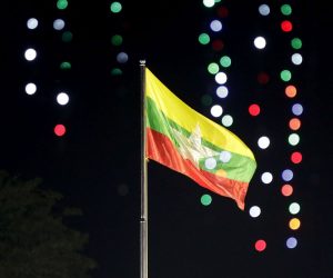epa08918224 Myanmar national flag is being raised during the flag-raising ceremony to mark the 73rd Myanmar Independence Day in Yangon, Myanmar, 04 January 2021. Myanmar, also known as Burma, was colonized by Britain in 1824 and became an independent republic on 04 January 1948.  EPA/LYNN BO BO