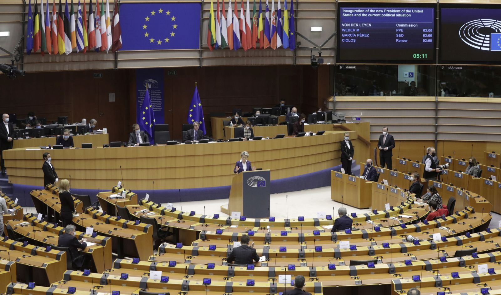 epa08950762 European Commission President Ursula von der Leyen (C, standing) speaks during a debate on the inauguration of the new President of the United States and the current political situation, during a plenary session of the European Parliament, in Brussels, Belgium, 20 January 2021.  EPA/OLIVIER HOSLET