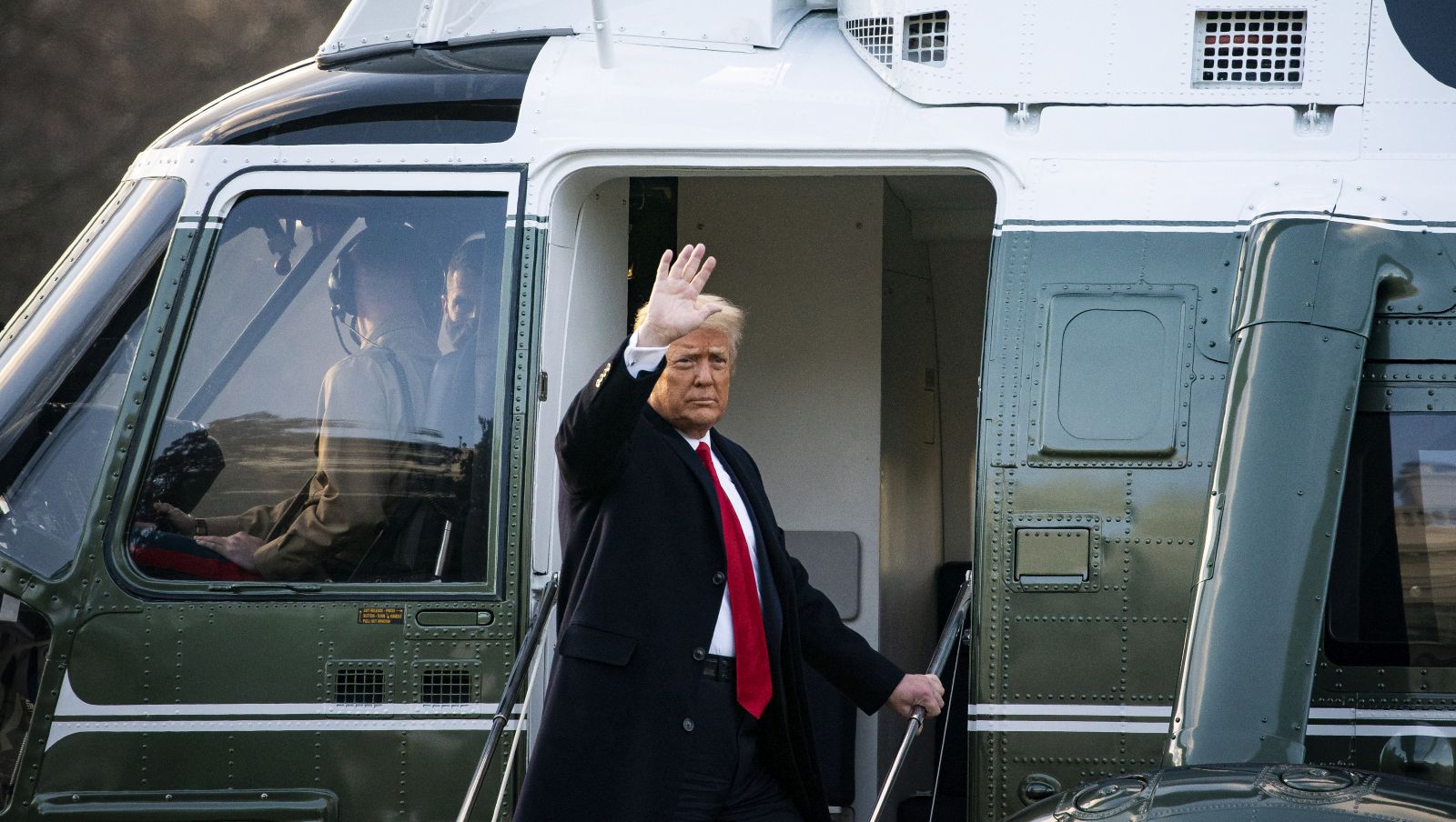 epa08951465 US President Donald J. Trump boards Marine One on the South Lawn after exiting the White House for the last time on the morning of Joe Biden's Presidential inauguration, in Washington, DC, USA, 20 January 2021. Joe Biden won the 03 November 2020 election to become the 46th President of the United States of America.  EPA/AL DRAGO / POOL