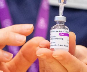 epa08966496 (FILE) - A nurse prepares a dose of the Oxford/AstraZeneca Covid-19 vaccine at the NHS vaccine mass vaccination centre that has been set up in the grounds of Epsom Race Course, in Surrey, Britain 11 January 2021 (reissued 26 January 2021). AstraZeneca has denied reports of a reduced efficiacy of its COVID-19 vaccine.  EPA/DOMINIC LIPINSKI / POOL