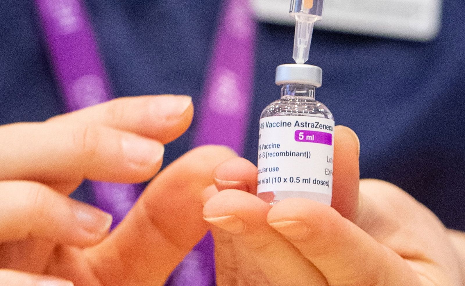 epa08966496 (FILE) - A nurse prepares a dose of the Oxford/AstraZeneca Covid-19 vaccine at the NHS vaccine mass vaccination centre that has been set up in the grounds of Epsom Race Course, in Surrey, Britain 11 January 2021 (reissued 26 January 2021). AstraZeneca has denied reports of a reduced efficiacy of its COVID-19 vaccine.  EPA/DOMINIC LIPINSKI / POOL