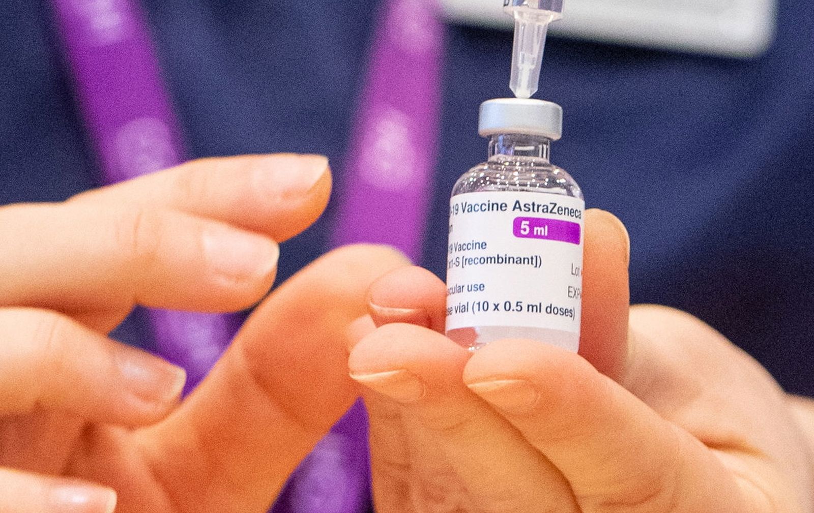 epa08966496 (FILE) - A nurse prepares a dose of the Oxford/AstraZeneca Covid-19 vaccine at the NHS vaccine mass vaccination centre that has been set up in the grounds of Epsom Race Course, in Surrey, Britain 11 January 2021 (reissued 26 January 2021). AstraZeneca has denied reports of a reduced efficiacy of its COVID-19 vaccine.  EPA/DOMINIC LIPINSKI / POOL
