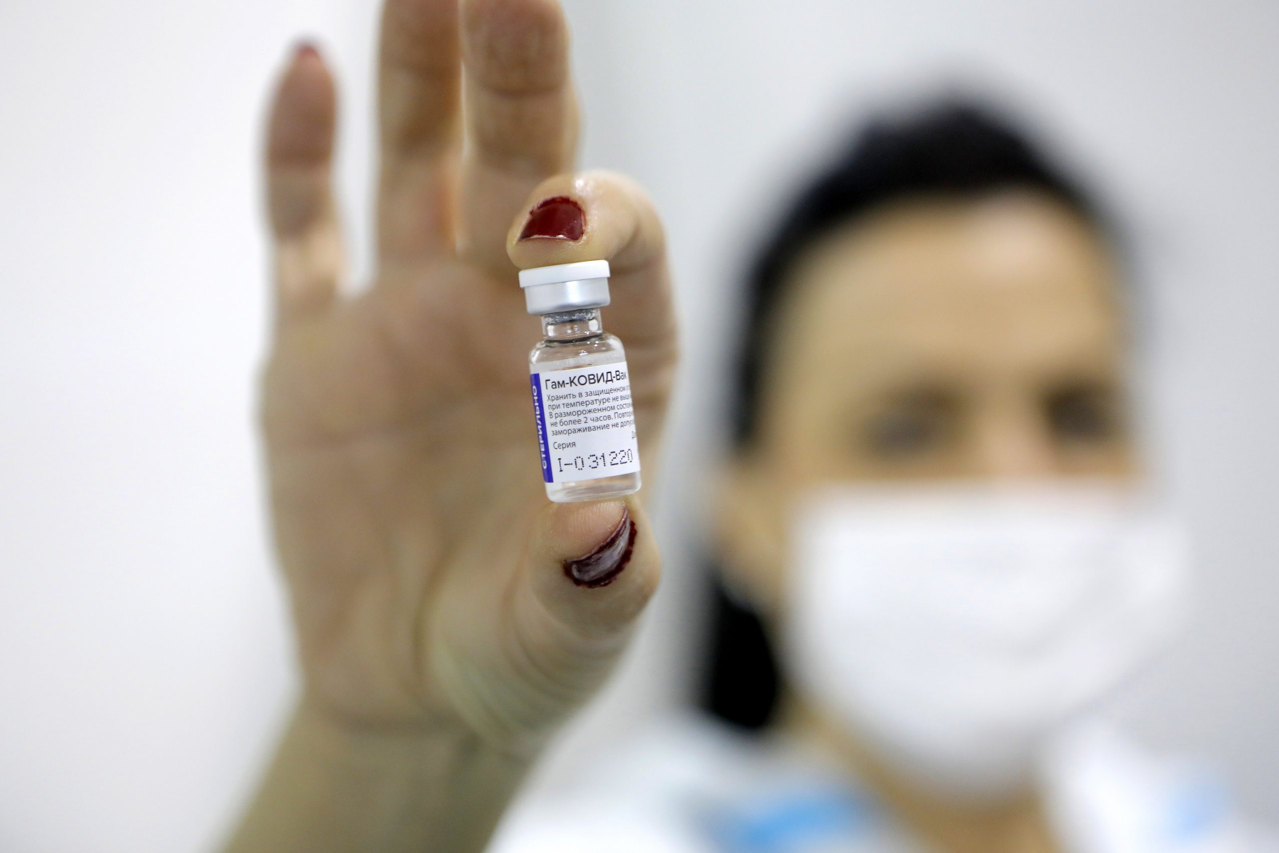 epa08981473 (FILE) - A medical worker shows a dose of Russia's Sputnik V Gam-COVID-Vac vaccine against the COVID-19 to a patient during the vaccination at Belgrade Fair makeshift vaccination center in Belgrade, Serbia, 01 February 2021 (reissued 02 Februiary 2021). Results of a study published in The Lancet on 02 February 2021 say that the Russian Covid-19 vaccine Sputnik V has an efficacy of 91.6 percent. The vaccine had been rolled out by Russia before Phase 3 trials were finished.  EPA/MARKO DJOKOVIC