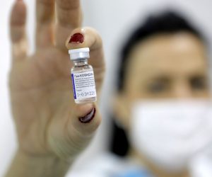 epa08981473 (FILE) - A medical worker shows a dose of Russia's Sputnik V Gam-COVID-Vac vaccine against the COVID-19 to a patient during the vaccination at Belgrade Fair makeshift vaccination center in Belgrade, Serbia, 01 February 2021 (reissued 02 Februiary 2021). Results of a study published in The Lancet on 02 February 2021 say that the Russian Covid-19 vaccine Sputnik V has an efficacy of 91.6 percent. The vaccine had been rolled out by Russia before Phase 3 trials were finished.  EPA/MARKO DJOKOVIC