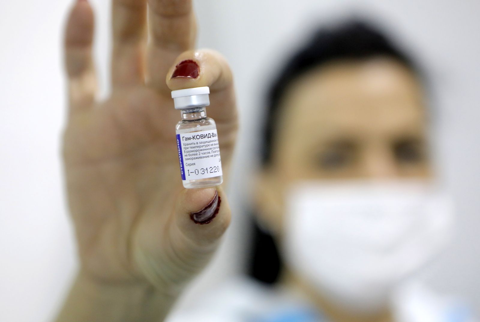 epa08981473 (FILE) - A medical worker shows a dose of Russia's Sputnik V Gam-COVID-Vac vaccine against the COVID-19 to a patient during the vaccination at Belgrade Fair makeshift vaccination center in Belgrade, Serbia, 01 February 2021 (reissued 02 Februiary 2021). Results of a study published in The Lancet on 02 February 2021 say that the Russian Covid-19 vaccine Sputnik V has an efficacy of 91.6 percent. The vaccine had been rolled out by Russia before Phase 3 trials were finished.  EPA/MARKO DJOKOVIC