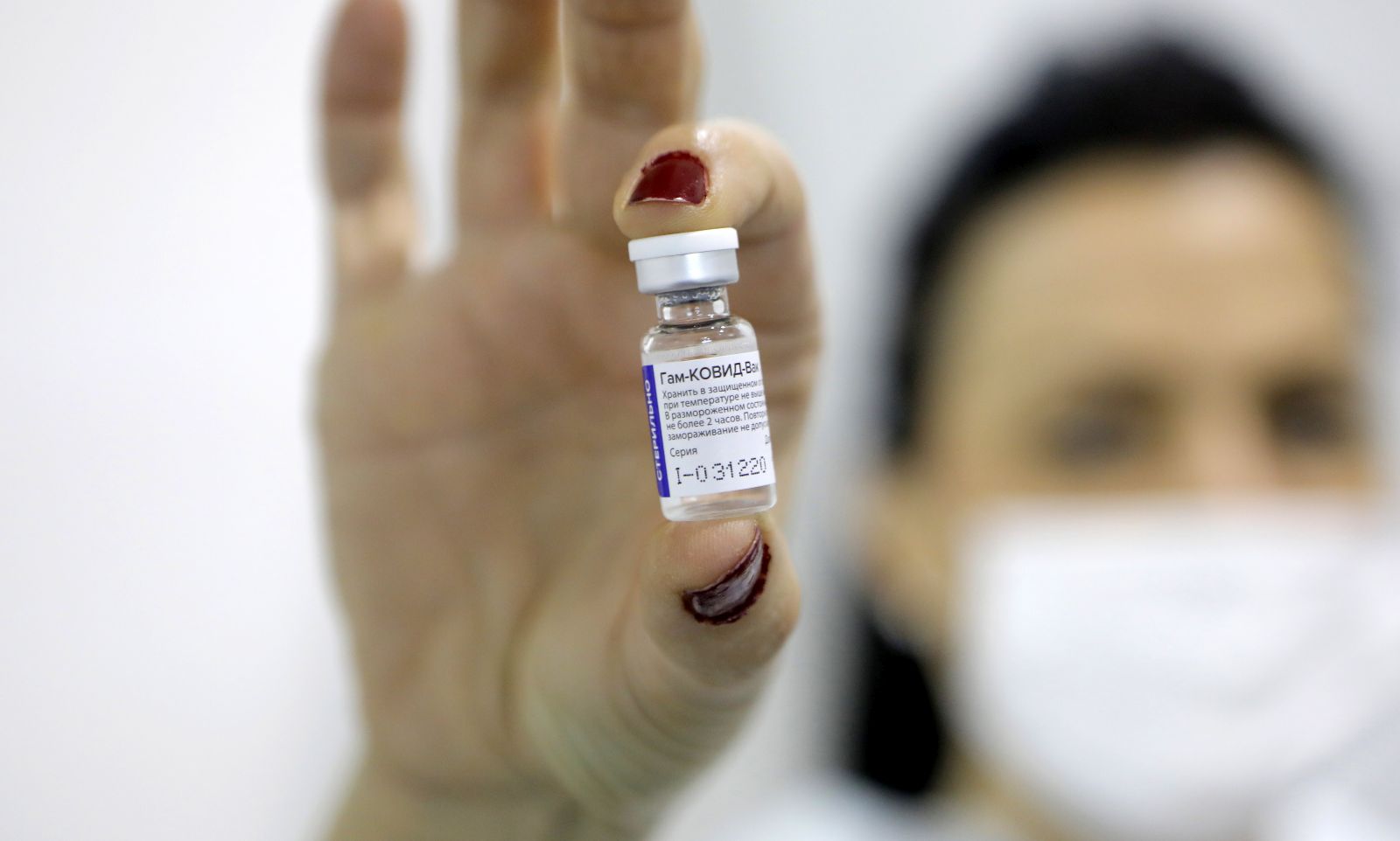 epa08981473 (FILE) - A medical worker shows a dose of Russia's Sputnik V Gam-COVID-Vac vaccine against the COVID-19 to a patient during the vaccination at Belgrade Fair makeshift vaccination center in Belgrade, Serbia, 01 February 2021 (reissued 02 Februiary 2021). Results of a study published in The Lancet on 02 February 2021 say that the Russian Covid-19 vaccine Sputnik V has an efficacy of 91.6 percent. The vaccine had been rolled out by Russia before Phase 3 trials were finished.  EPA/MARKO DJOKOVIC