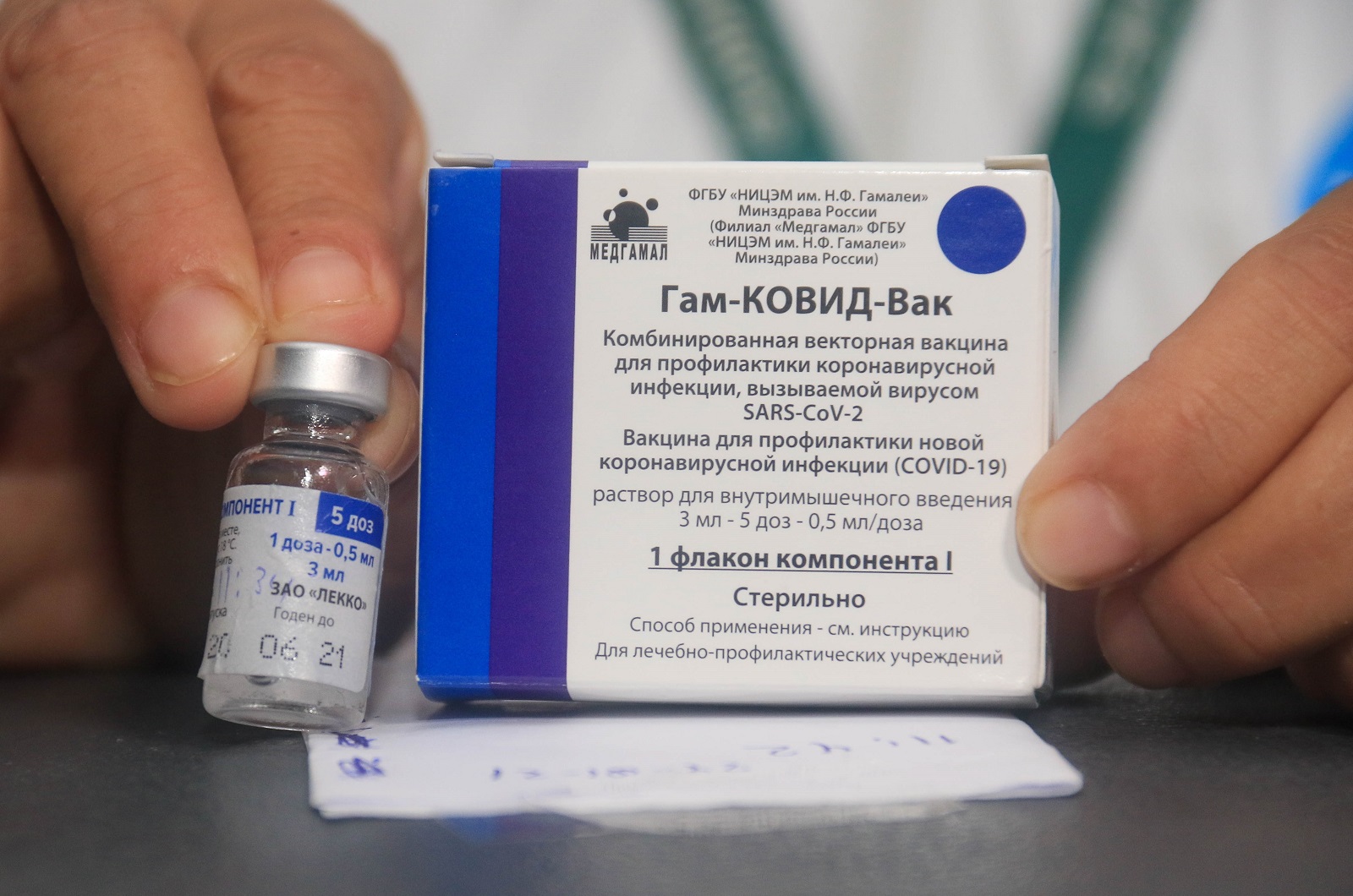 epa08981472 (FILE) - A nurse shows the vaccine against Covid-19 to apply it to doctors and health workers, after the arrival of the first 20,000 doses of the Russian Sputnik V, at the Japanese Hospital of Santa Cruz, Bolivia, 29 January 2021 (reissued 02 February 2021). Results of a study published in The Lancet on 02 February 2021 say that the Russian Covid-19 vaccine Sputnik V has an efficacy of 91.6 percent. The vaccine had been rolled out by Russia before Phase 3 trials were finished.  EPA/JUAN CARLOS TORREJON