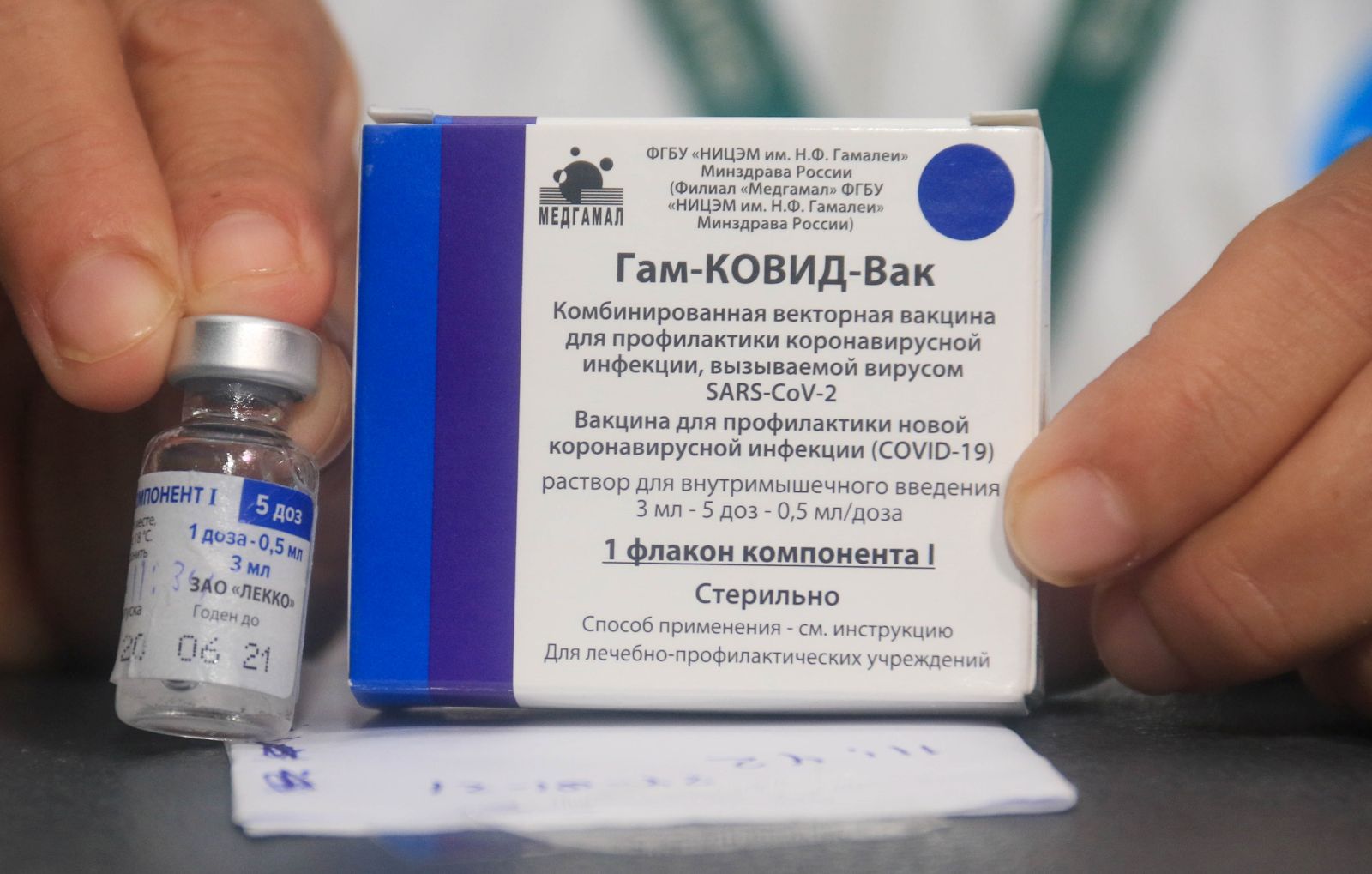 epa08981472 (FILE) - A nurse shows the vaccine against Covid-19 to apply it to doctors and health workers, after the arrival of the first 20,000 doses of the Russian Sputnik V, at the Japanese Hospital of Santa Cruz, Bolivia, 29 January 2021 (reissued 02 February 2021). Results of a study published in The Lancet on 02 February 2021 say that the Russian Covid-19 vaccine Sputnik V has an efficacy of 91.6 percent. The vaccine had been rolled out by Russia before Phase 3 trials were finished.  EPA/JUAN CARLOS TORREJON