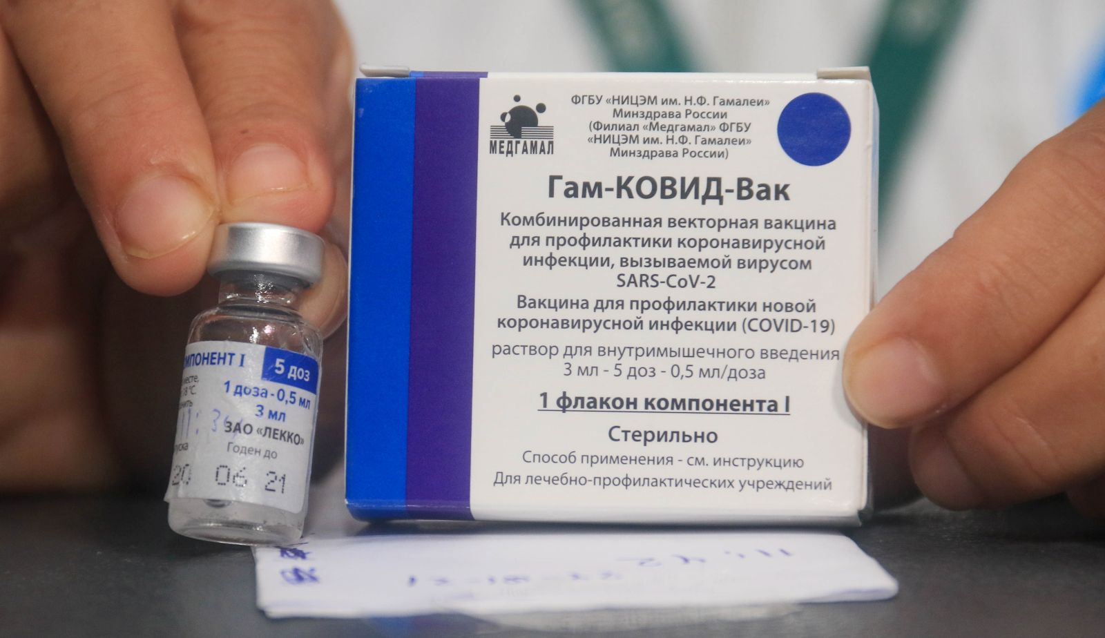 epa08981472 (FILE) - A nurse shows the vaccine against Covid-19 to apply it to doctors and health workers, after the arrival of the first 20,000 doses of the Russian Sputnik V, at the Japanese Hospital of Santa Cruz, Bolivia, 29 January 2021 (reissued 02 February 2021). Results of a study published in The Lancet on 02 February 2021 say that the Russian Covid-19 vaccine Sputnik V has an efficacy of 91.6 percent. The vaccine had been rolled out by Russia before Phase 3 trials were finished.  EPA/JUAN CARLOS TORREJON