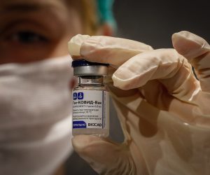 epa08981471 (FILE) - Russian medic holds Russia's Sputnik V Gam-COVID-Vac vaccine at the vaccination point at the State Department Store GUM in Moscow, Russia 19 January 2021 (reissued 02 February 2021). Results of a study published in The Lancet on 02 February 2021 say that the Russian Covid-19 vaccine Sputnik V has an efficacy of 91.6 percent. The vaccine had been rolled out by Russia before Phase 3 trials were finished.  EPA/YURI KOCHETKOV