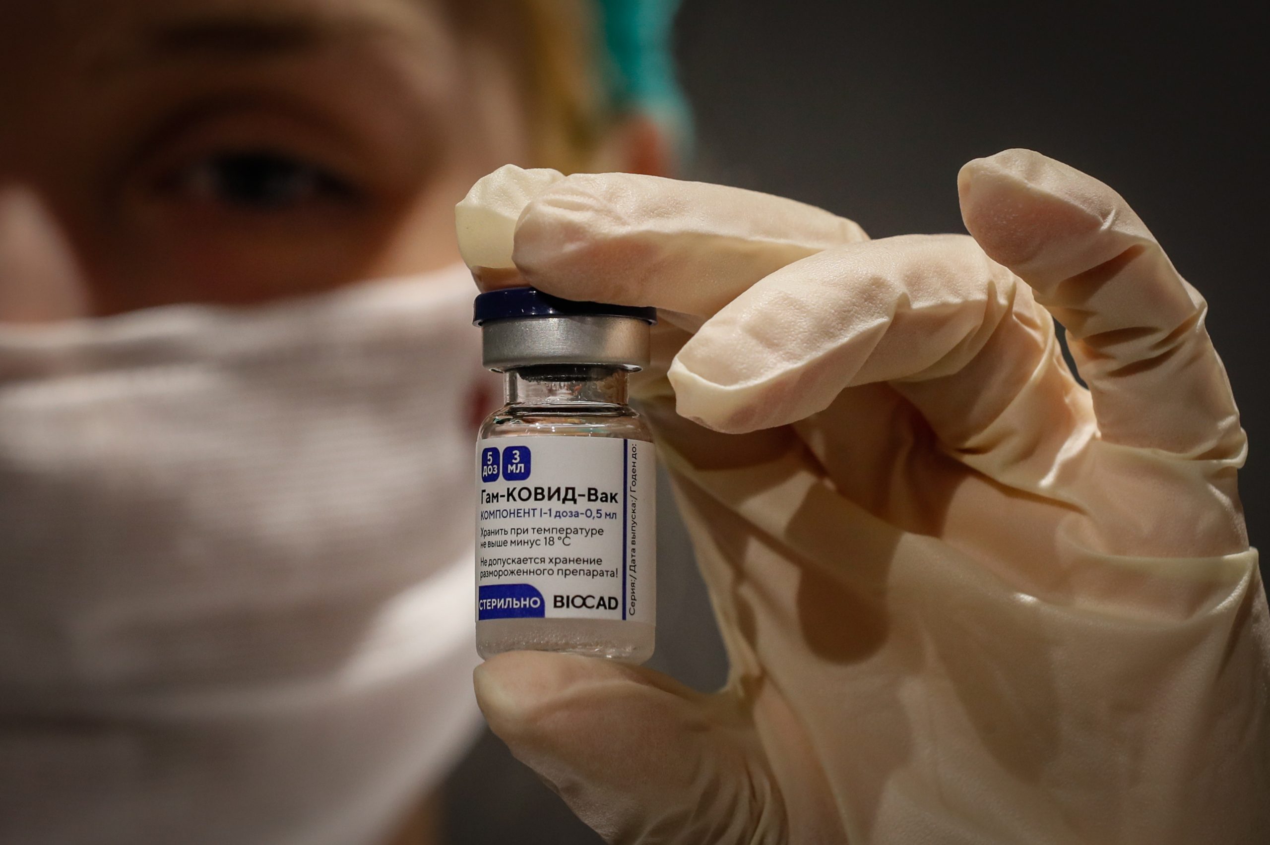 epa08981471 (FILE) - Russian medic holds Russia's Sputnik V Gam-COVID-Vac vaccine at the vaccination point at the State Department Store GUM in Moscow, Russia 19 January 2021 (reissued 02 February 2021). Results of a study published in The Lancet on 02 February 2021 say that the Russian Covid-19 vaccine Sputnik V has an efficacy of 91.6 percent. The vaccine had been rolled out by Russia before Phase 3 trials were finished.  EPA/YURI KOCHETKOV