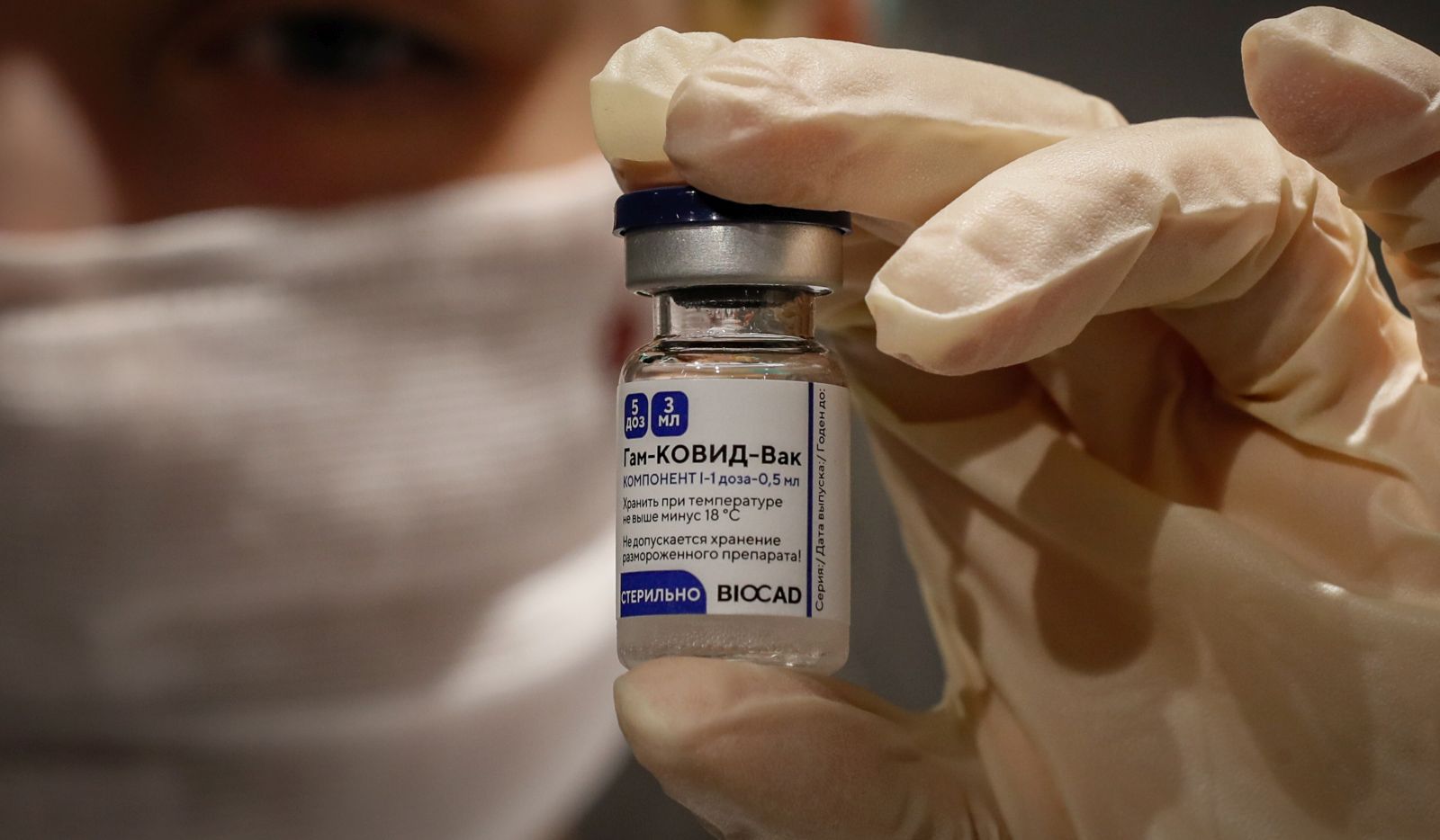 epa08981471 (FILE) - Russian medic holds Russia's Sputnik V Gam-COVID-Vac vaccine at the vaccination point at the State Department Store GUM in Moscow, Russia 19 January 2021 (reissued 02 February 2021). Results of a study published in The Lancet on 02 February 2021 say that the Russian Covid-19 vaccine Sputnik V has an efficacy of 91.6 percent. The vaccine had been rolled out by Russia before Phase 3 trials were finished.  EPA/YURI KOCHETKOV