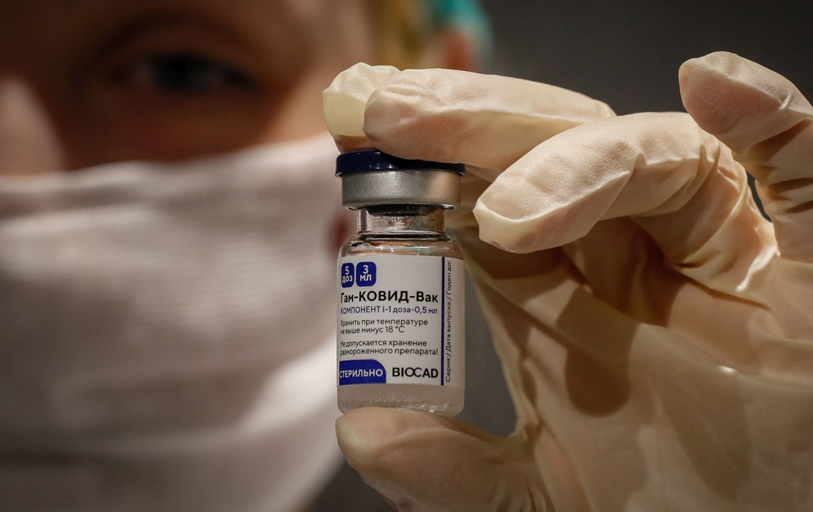 epa08981471 (FILE) - Russian medic holds Russia's Sputnik V Gam-COVID-Vac vaccine at the vaccination point at the State Department Store GUM in Moscow, Russia 19 January 2021 (reissued 02 February 2021). Results of a study published in The Lancet on 02 February 2021 say that the Russian Covid-19 vaccine Sputnik V has an efficacy of 91.6 percent. The vaccine had been rolled out by Russia before Phase 3 trials were finished.  EPA/YURI KOCHETKOV