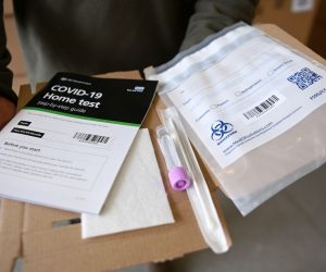 epa08981515 A Covid-19 home test kit is displaued at Woking Fire Station in Woking, Britain, 02 February 2021. Door-to-door testing of some eighty thousand people is underway in England to find cases of the South Africa coronavirus variant. Eleven cases were discovered in people with no links to travel or previous cases of the strain. British Health Secretary Matt Hancock stated it is 'on all of us' to contain the new variant, which is feared to be spreading in communities.  EPA/ANDY RAIN