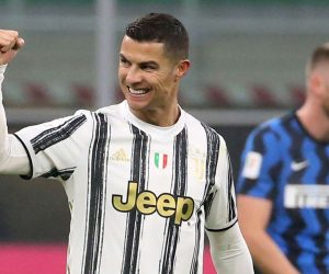 epa08982555 Juventus’ Cristiano Ronaldo celebrates after scoring the 1-2 goal during the Italy Cup semifinal first leg soccer match between FC Inter and Juventus FC at Giuseppe Meazza stadium in Milan, Italy, 02 February 2021.  EPA/MATTEO BAZZI