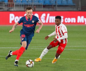 epa08982560 Sevilla's Ivan Rakitic (L) in action against Largie Ramazani (R) of UD Almeria during the Spanish King Cup's quarter finals soccer match between Almeria and Sevilla at Mediterranean Games stadium in Almeria, southern Spain, 02 February 2021.  EPA/Carlos Barba
