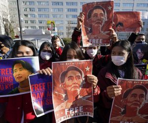 epa08983416 Myanmar nationals in Japan hold up portraits of Aung San Suu Kyi during a protest held in front of Japan’s Foreign Ministry in Tokyo, Japan, 03 February 2021. Myanmar's military seized power and declared a state of emergency for one year after arresting State Counselor Aung San Suu Kyi and Myanmar president Win Myint in an early morning raid on 01 February, following increasing tension over the result of last November's parliamentary elections.  EPA/FRANCK ROBICHON