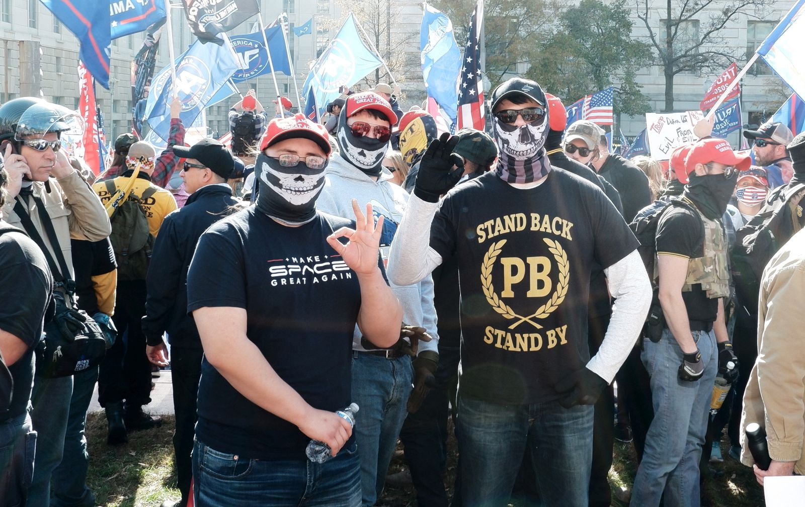 epa08985259 (FILE) - Two people, one of them with a Proud Boys shirt, gesture with the White Power sign, as supporters of US President Donald J. Trump gather to support his legal challenges to the 2020 presidential election, in Freedom Plaza, in Washington, DC, USA, 14 November 2020 (reissued 03 February 2021). Canada has labbeled the Far-right group the Proud Boys a terrorist group, Canadian public safety minister Bill Blair announced on 03 February 2021.  EPA/GAMAL DIAB *** Local Caption *** 56499065