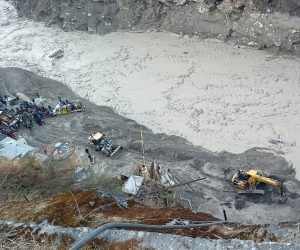 epa08993669 A general view of a rescue operation near the Dhauliganga hydro power project after a portion of Nanda Devi glacier broke off, at Reni village in Chamoli district, Uttrakhand, India, 07 February 2021. Over 100 people are feared dead after part of the Nanda Devi glacier broke off causing massive floods in the Tapovan area of Uttarakhand's Chamoli district.  EPA/ARVIND MOUDGIL -- BEST QUALITY AVAILABLE --