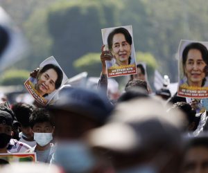 epa08997753 Demonstrators hold up pictures of detained Myanmar State Counselor Aung San Suu Kyi during a protest against the military coup, in Yangon, Myanmar, 09 February 2021. Thousands of people continued to rally in Yangon despite stern warnings from the military after days of mass protests. Orders were issued on 08 February in major cities and townships banning people from protesting or gathering in groups of more than five. A nighttime curfew was also imposed. Myanmar's military seized power and declared a state of emergency for one year after arresting State Counselor Aung San Suu Kyi, the country's president and other political figures in an early morning raid on 01 February.  EPA/LYNN BO BO