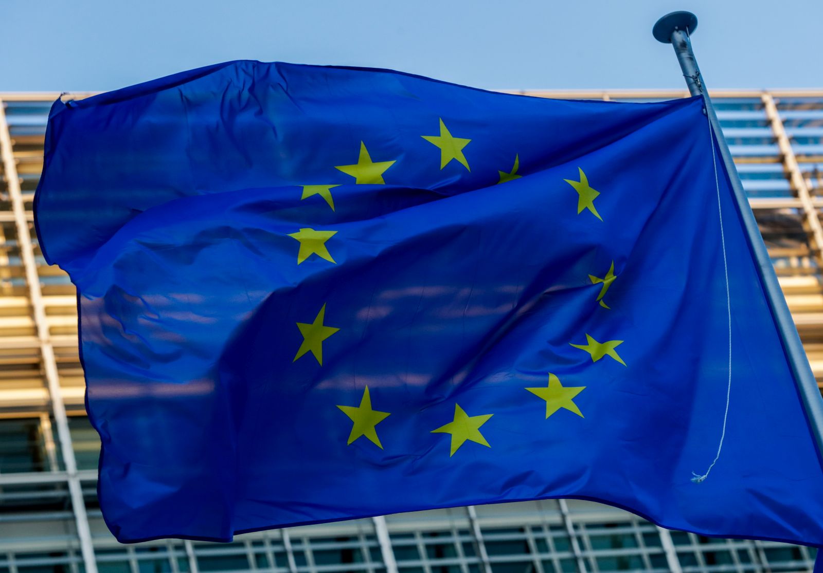 epa08999148 A European flag is seen in front of the European Commission in Brussels, Belgium, 09 February 2021.  EPA/STEPHANIE LECOCQ