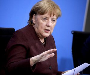 epa09002137 German Chancellor Angela Merkel speaks at a press conference after a video conference with German State Premiers about the current coronavirus situation, at the Chancellery in Berlin, Germany, 10 February 2021.  EPA/CHRISTIAN MARQUARDT / POOL