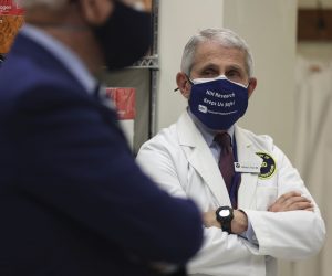 epa09005407 Dr. Anthony Fauci, director of the National Institute of Allergy and Infectious Diseases listens as US President Joe Biden talks duding a visit to the Viral Pathogenesis Laboratory at the National Institutes of Health, in Bethesda, Maryland, USA, 11 February 2021.  EPA/Oliver Contreras / POOL