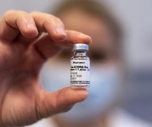 epa09006876 A vial containing Russian vaccine Sputnik V is shown by a nurse at Central Hospital of the Hungarian Defence Forces (military) in Budapest, Hungary, 12 February 2021 as the vaccination with Sputnik V agains covid-19 begins in the country.  EPA/ZSOLT SZIGETVARY HUNGARY OUT
