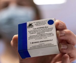 epa09006873 A box containing Russian vaccine Sputnik V is shown by a nurse at Central Hospital of the Hungarian Defence Forces (military) in Budapest, Hungary, 12 February 2021 as the vaccination with Sputnik V agains covid-19 begins in the country.  EPA/ZSOLT SZIGETVARY HUNGARY OUT