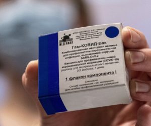epa09006873 A box containing Russian vaccine Sputnik V is shown by a nurse at Central Hospital of the Hungarian Defence Forces (military) in Budapest, Hungary, 12 February 2021 as the vaccination with Sputnik V agains covid-19 begins in the country.  EPA/ZSOLT SZIGETVARY HUNGARY OUT
