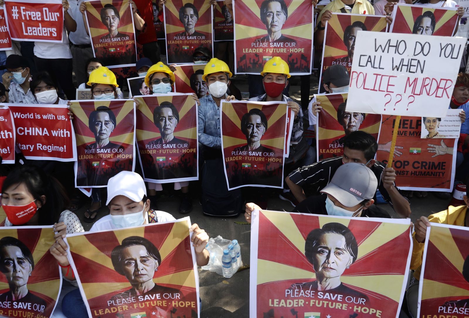 epa09008439 Protesters hold placards calling for the release of detained Myanmar State Counselor Aung San Suu Kyi during a protest against the military coup outside the Chinese Embassy in Yangon, Myanmar, 13 February 2021. People continued to rally across the country despite orders banning mass gatherings and reports of increasing use of force by police against anti-coup protesters. Myanmar's military seized power and declared a state of emergency for one year after arresting State Counselor Aung San Suu Kyi and Myanmar president Win Myint in an early morning raid on 01 February.  EPA/LYNN BO BO