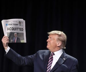 epa09010714 (FILE) - US President Donald J. Trump holds a copy of the USA Today newspaper fronting with his impeachment acquittal, as he arrives to the 68th Annual National Prayer Breakfast in Washington, DC, USA, 06 February 2020 (reissued 13 February 2021). The US Senate on 13 February 2021 voted to acquit former US president Trump in his second impeachment trial held on the charge of incitement of insurrection for his role in 06 January violent attack on the US Capitol.  EPA/Oliver Contreras / POOL *** Local Caption *** 55853899
