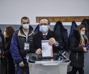 epa09011507 A handout photo made available by the Government of Kosovo shows Acting Prime Minister of Kosovo Avdullah Hoti (C) casting his vote at a voting center in Pristina, Kosovo, 14 February 2021. Kosovo's early parliamentary elections will be held on 14 February 2021. Around 1.8 million voters have the right to cast ballots during snap elections to elect a new 120 seat parliament.  EPA/ERMAL META/KOSOVO GOVERNMENT HANDOUT  HANDOUT EDITORIAL USE ONLY/NO SALES