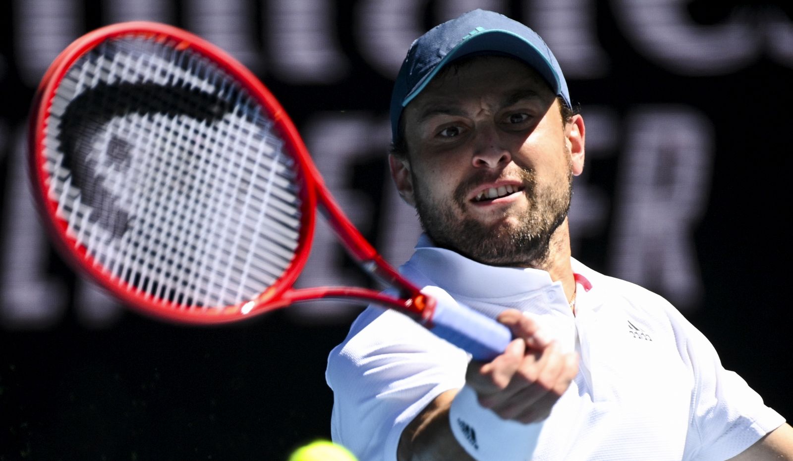 epa09015333 Aslan Karatsev of Russia in action during his Quarterfinals Men's singles match against Grigor Dimitrov of Bulgaria on Day 9 of the Australian Open Grand Slam tennis tournament at Melbourne Park in Melbourne, Australia, 16 February 2021.  EPA/DEAN LEWINS AUSTRALIA AND NEW ZEALAND OUT