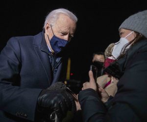 epa09017413 US President Joe Biden (L) responds to a question from a journalist as he steps off Marine One on the South Lawn of the White House in Washington, DC, USA, 17 February 2021. President Biden returned to the White House following a town hall meeting.  EPA/SHAWN THEW