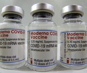 epa09017657 Three vials of the 'Moderna COVID-19 Vaccine' are pictured in a new coronavirus COVID-19 vaccination center at the 'Velodrom' stadium in Berlin, Germany, 17 February 2021.  EPA/MICHAEL SOHN / POOL