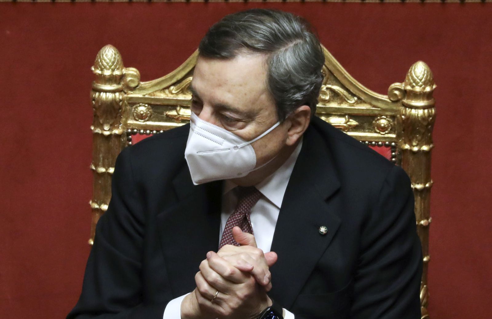 epa09019062 Mario Draghi, Italy's prime minister, listens during a debate at the Senate in Rome, Italy, 17 February 2021. The new government will face vote of confidence in the Senate on 17 February and later another vote in the lower chamber on 18 February. Draghi and his new cabinet were sworn in before President Sergio Mattarella on 13 February 2021.  EPA/ALESSIA PIERDOMENICO / POOL