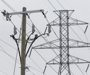 epa09020022 Electricity pylons in Fort Worth, Texas, USA on 17 February 2021. Snow and cold weather have blanketed North Texas for the fourth day in unseasonably cold weather with overnight temperatures at -10 degrees celsius. The electric grid in Texas run by the non profit Ercot, has been overwhelmed by high demand leaving millions without power in the state.  EPA/Ralph Lauer