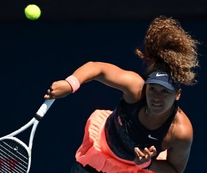 epa09020200 Naomi Osaka of Japan in action during her Women's singles semifinals match against Serena Williams of the United States on Day 11 of the Australian Open Grand Slam tennis tournament at Melbourne Park in Melbourne, Australia, 18 February 2021.  EPA/DEAN LEWINS AUSTRALIA AND NEW ZEALAND OUT