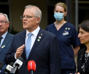 epa09022794 Australian Prime Minister Scott Morrison (C) and NSW Premier Gladys Berejiklian (R) address media following a tour of a COVID-19 vaccination hub at Royal Prince Alfred hospital in Sydney, Australia, 19 February 2021. The first COVID-19 vaccinations in NSW will take place on Monday, with the Pfizer jab to go out to frontline workers.  EPA/DAN HIMBRECHTS  AUSTRALIA AND NEW ZEALAND OUT