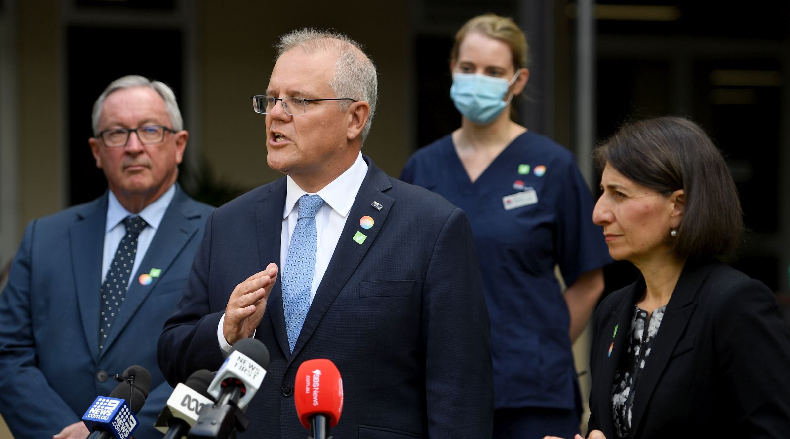 epa09022794 Australian Prime Minister Scott Morrison (C) and NSW Premier Gladys Berejiklian (R) address media following a tour of a COVID-19 vaccination hub at Royal Prince Alfred hospital in Sydney, Australia, 19 February 2021. The first COVID-19 vaccinations in NSW will take place on Monday, with the Pfizer jab to go out to frontline workers.  EPA/DAN HIMBRECHTS  AUSTRALIA AND NEW ZEALAND OUT