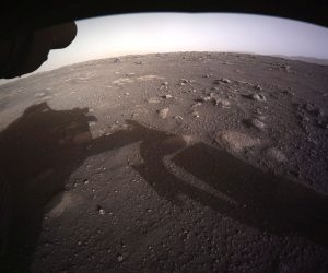epa09024690 A handout photo made available by NASA shows the first high-resolution, color image to be sent back by the Hazard Cameras (Hazcams) on the underside of NASA's Perseverance Mars rover after its landing, on 18 February 2021 (issued 19 February 2021). A camera aboard the descent stage captured this shot. A key objective for Perseverance's mission on Mars is astrobiology, including the search for signs of ancient microbial life. The rover will characterize the planet's geology and past climate, pave the way for human exploration of the Red Planet, and be the first mission to collect and cache Martian rock and regolith.  EPA/NASA/JPL-Caltech HANDOUT  HANDOUT EDITORIAL USE ONLY/NO SALES