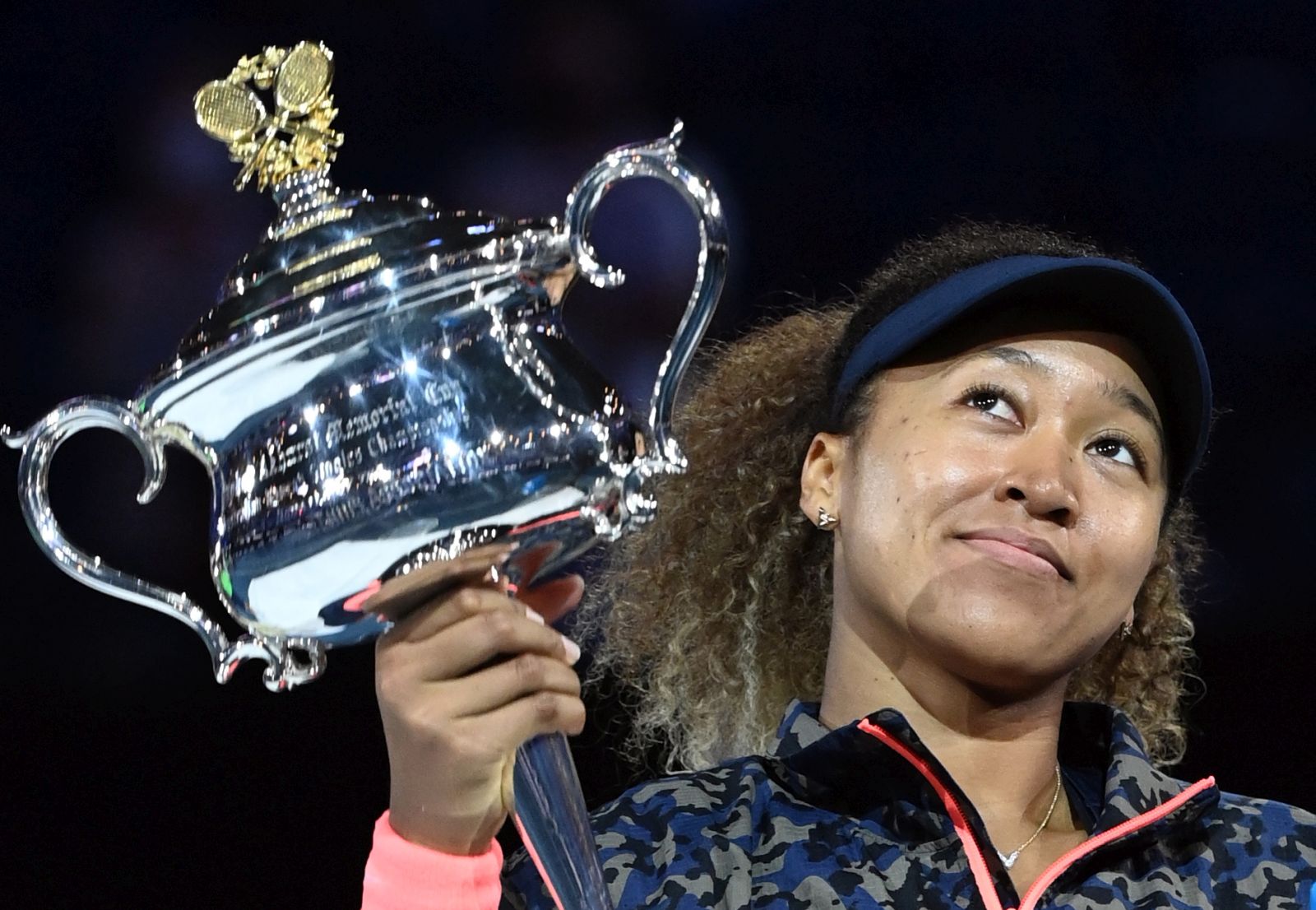 epaselect epa09025505 Naomi Osaka of Japan holds the trophy after winning the women's singles final against Jennifer Brady of the United States on day 13 of the Australian Open tennis tournament at Rod Laver Arena in Melbourne, Australia, 20 February 2021.  EPA/DAVE HUNT  AUSTRALIA AND NEW ZEALAND OUT