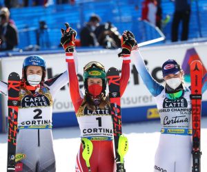 epa09025857 (L-R) Second placed Petra Vlhova of Slovakia, winner Katharina Liensberger of Austria and third placed Mikaela Shiffrin of the USA celebrate during the Women's Slalom race at the FIS Alpine Skiing World Championships in Cortina d'Ampezzo, Italy, 20 February 2021.  EPA/ANDREA SOLERO