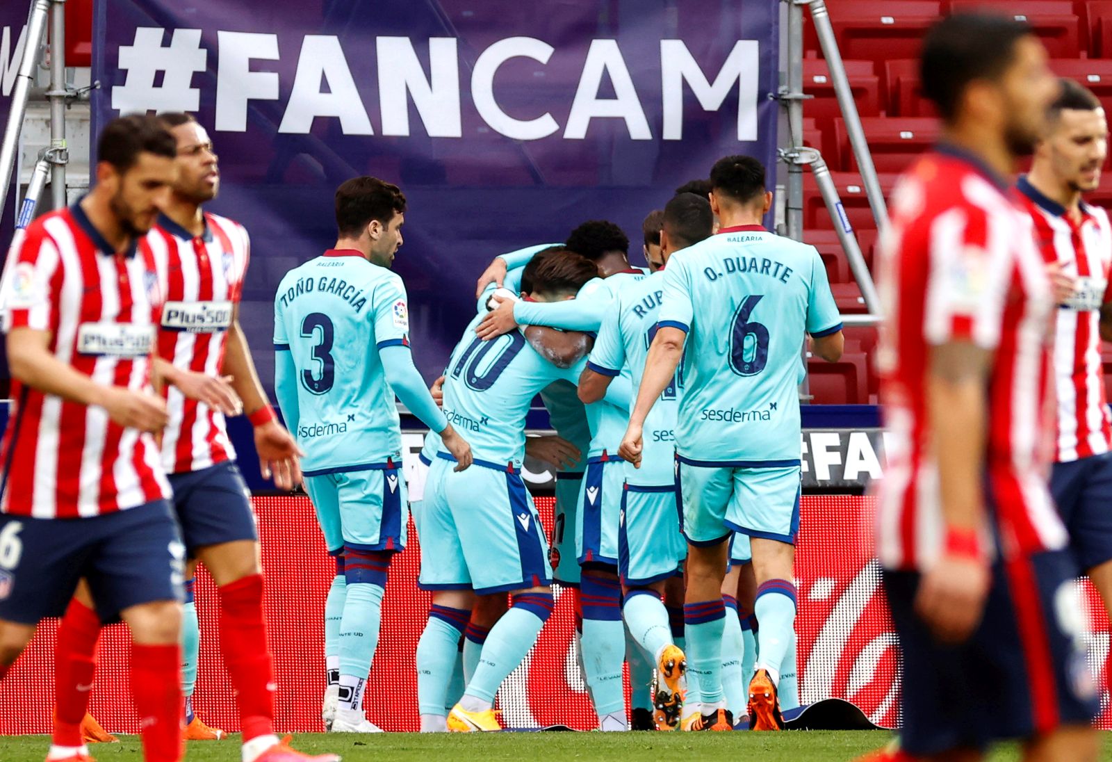 epa09026245 Levante players celebrate their 1-0 lead during the Spanish La Liga soccer match between Atletico Madrid and Levante UD in Madrid, Spain, 20 February 2021.  EPA/Chema Moya