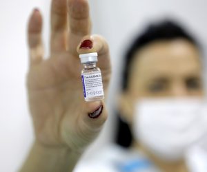 epa08981473 (FILE) - A medical worker shows a dose of Russia's Sputnik V Gam-COVID-Vac vaccine against the COVID-19 to a patient during the vaccination at Belgrade Fair makeshift vaccination center in Belgrade, Serbia, 01 February 2021 (reissued 02 Februiary 2021). Results of a study published in The Lancet on 02 February 2021 say that the Russian Covid-19 vaccine Sputnik V has an efficacy of 91.6 percent. The vaccine had been rolled out by Russia before Phase 3 trials were finished.  EPA/MARKO DJOKOVIC