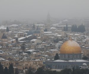 epa09020433 General view of the Dome of the Rock covered in snow, in the old city of Jerusalem, Israel, 18 February 2021.  EPA/ABIR SULTAN