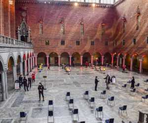 epa09027413 Nursing staff prepare the desks for a day of mass vaccination against Covid-19 in the Blue Hall of the Stockholm City Hall, the venue for the Nobel Prize banquets, in Stockholm, Sweden, 21 February 2021.  EPA/Jonas Ekströmer SWEDEN OUT SWEDEN OUT